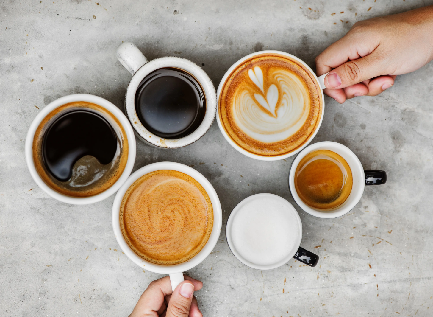 overhead view looking down at different cups of coffee